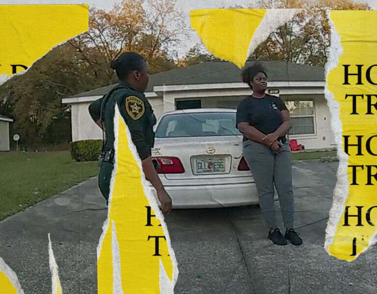 Two people stood by a car