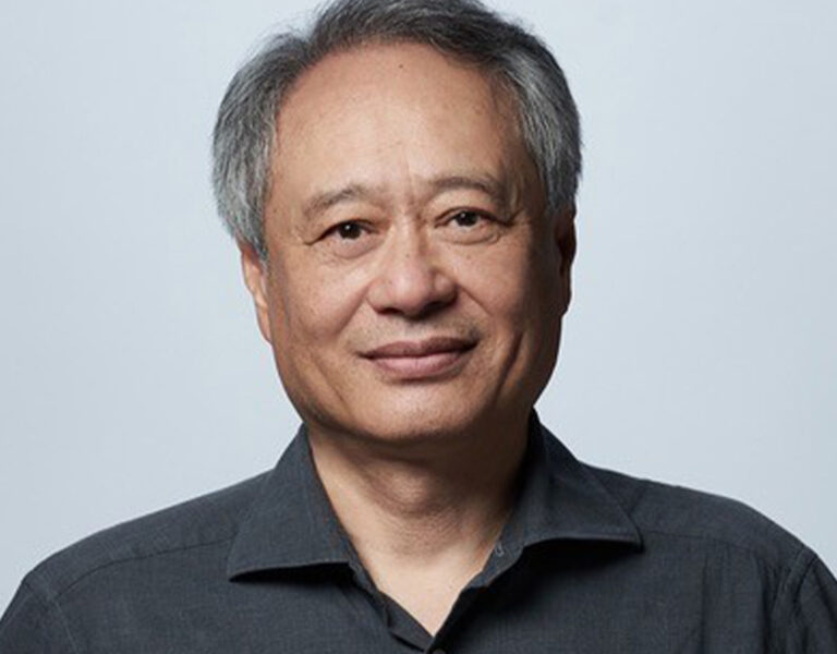 Ang Lee smiling into camera