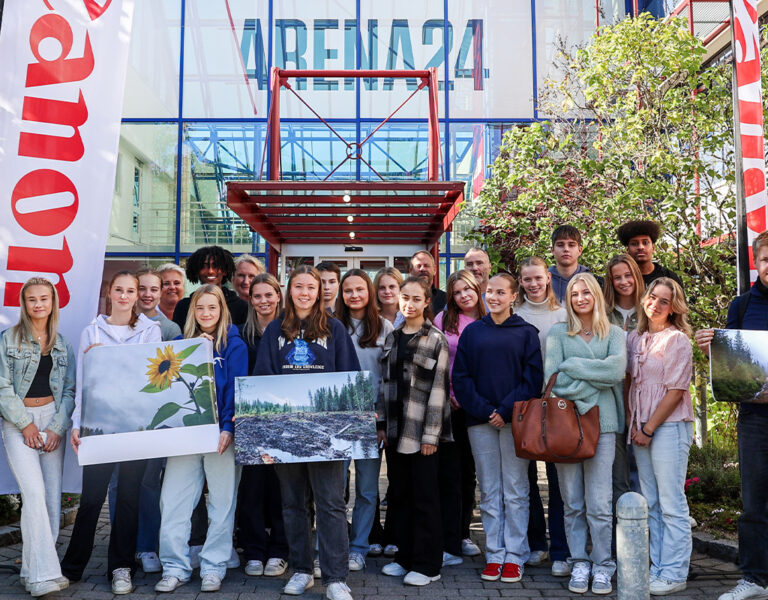 A group of people gathered in front of a building