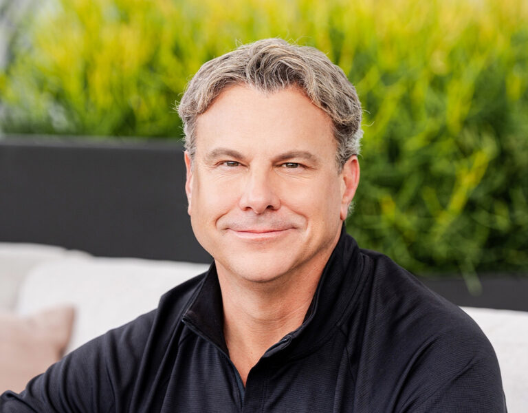 Harris smiling into camera