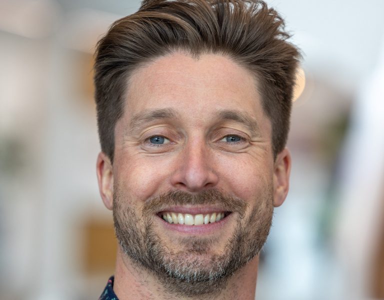 Mark Szeliga smiling into camera