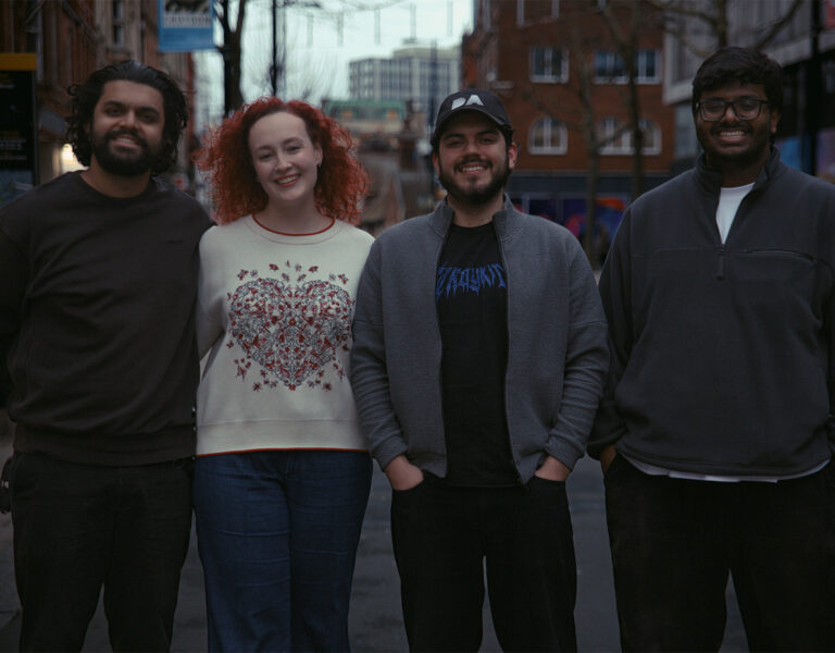 A group of people smiling together