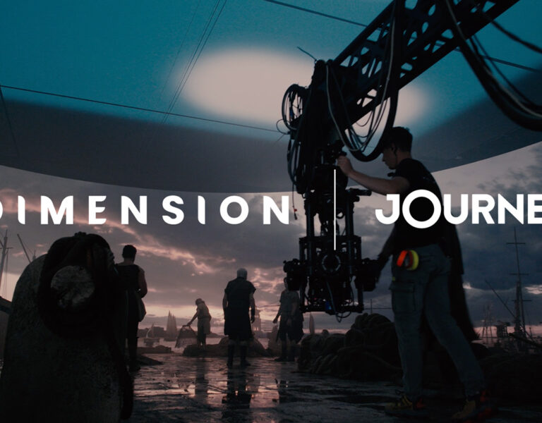 A film crew works on a set with a large camera rig under an artificial sky. Silhouetted figures and equipment are visible, with the words DIMENSION JOURNEY overlaid in bold white text, capturing the essence of global film-making.