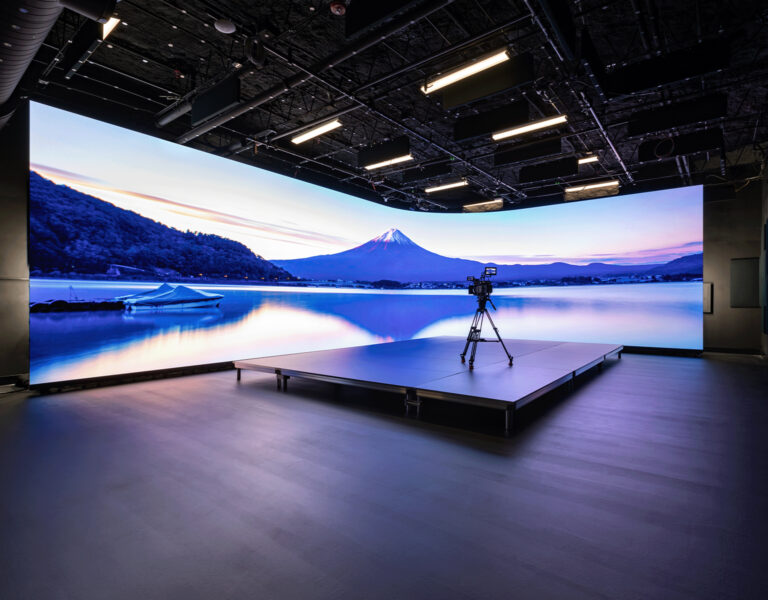 A large screen with a camera in front