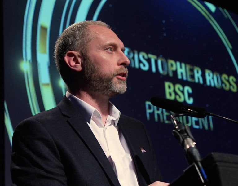 Christopher Ross talking on stage