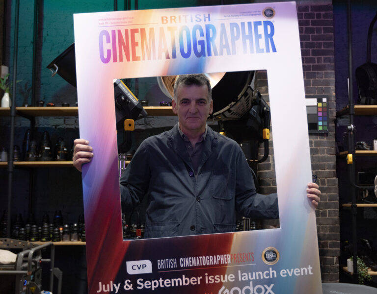 Henry Braham holding a British Cinematographer sign
