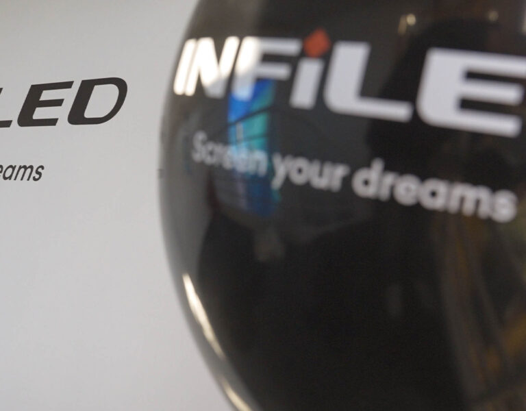 An Infiled balloon against a white wall