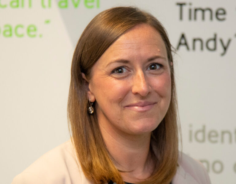 A woman smiling into camera