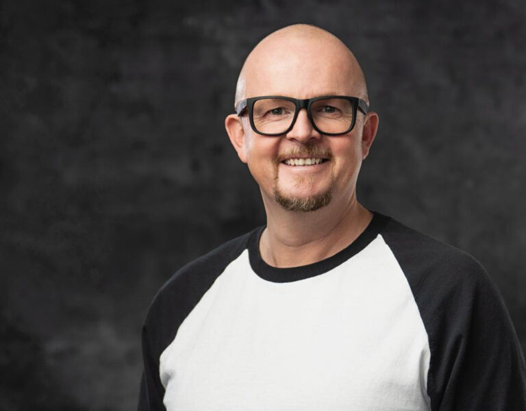 Frank Deutschländer smiling into camera