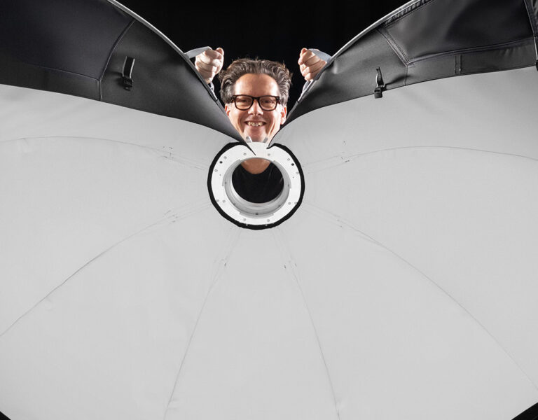 A man holding a large light