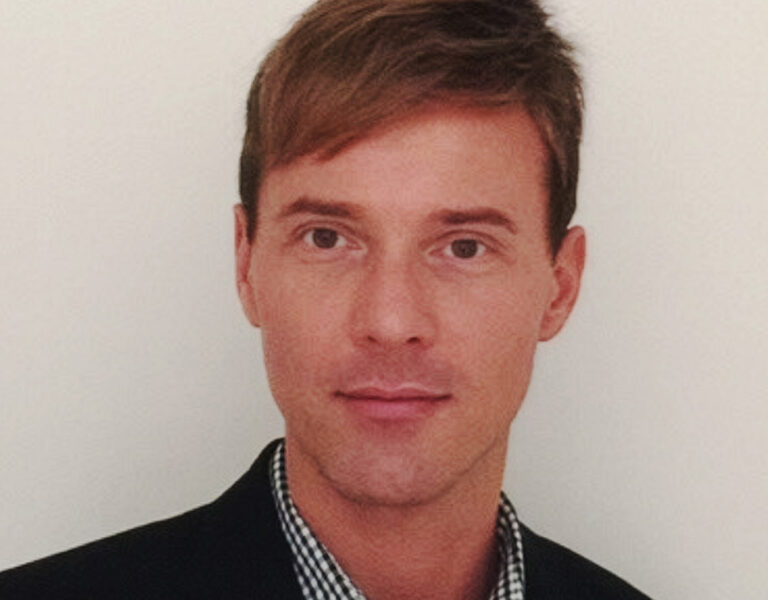 Mills looking into camera