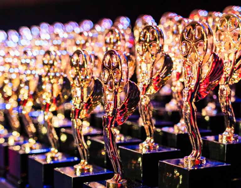 A table full of golden trophies