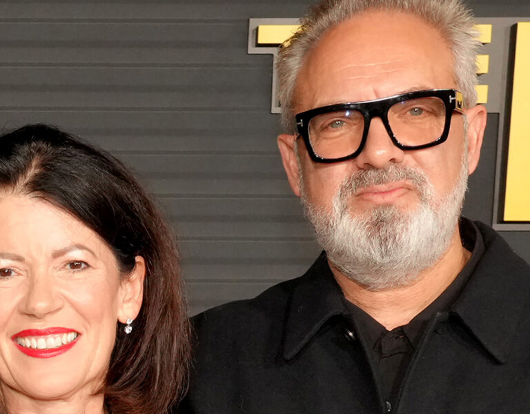 Two people stood together on a red carpet