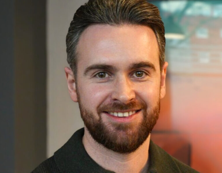 A man smiling into camera