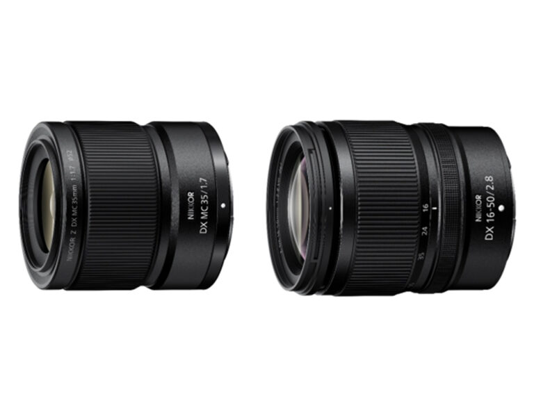 Two Nikon lenses on white background