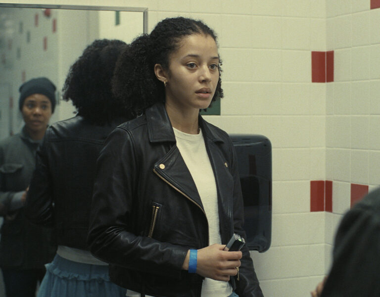 Two women talking in a bathroom