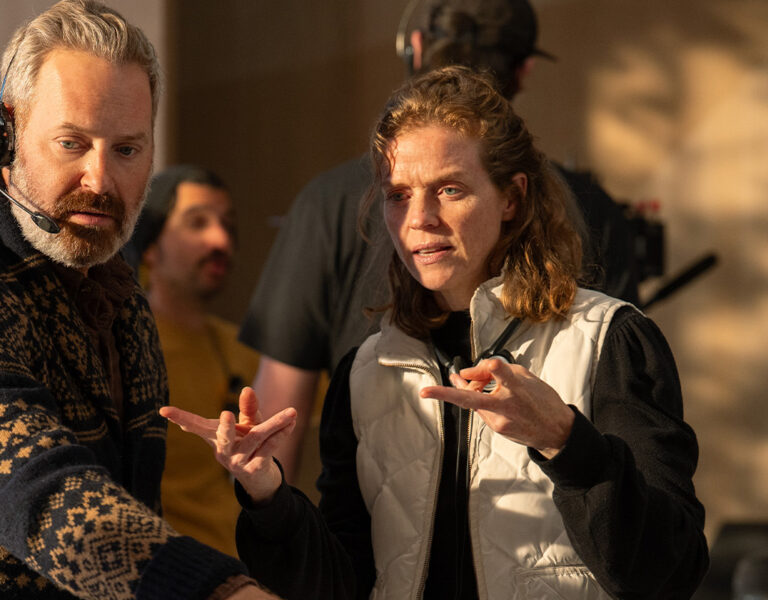 Two people stood together talking