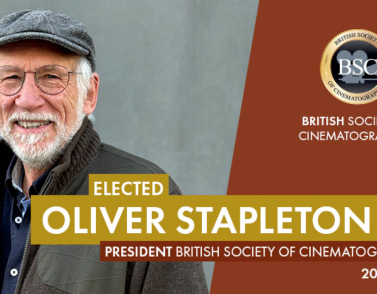 An older man with a grey beard and glasses, wearing a cap and coat, stands smiling. Text announces Oliver Stapleton as BSC president, elected by the British Society of Cinematographers for 2026–2028.