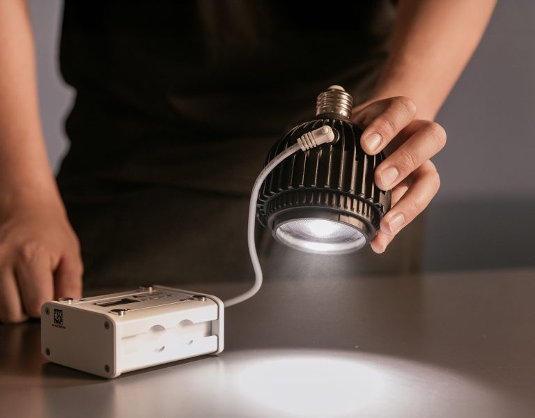 A person holding the SolaBulb