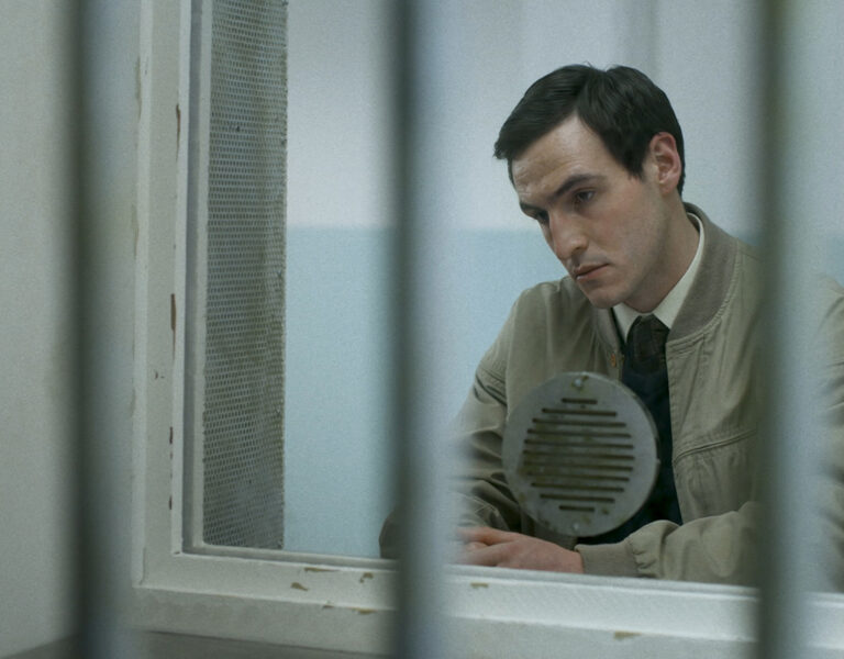 A man sat looking sad